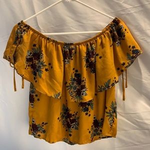 Off-the-shoulder floral top.